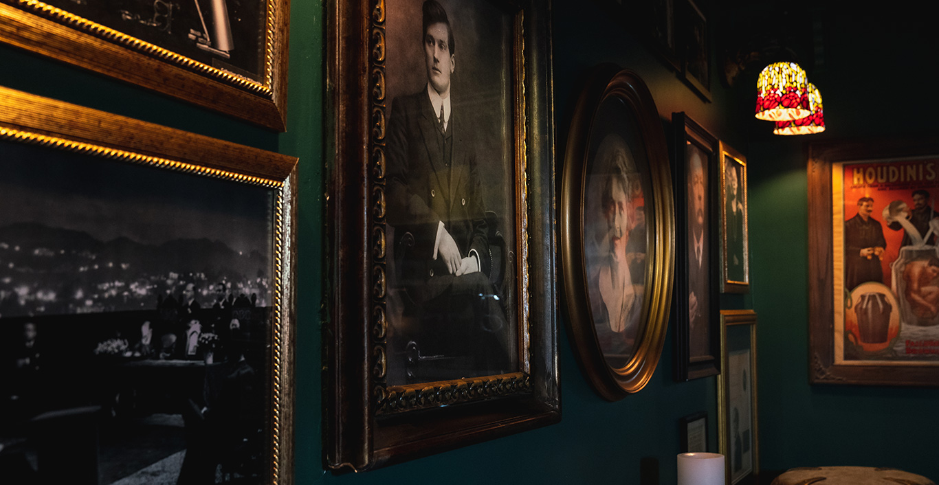 Picture of paintings on the wall in the Houdini Chamber