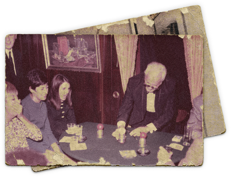 Photograph of legendary magician Dai Vernon performing in The Close-Up Gallery of The Magic Castle.